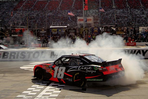 Kyle Busch celebrates his victory with a burnout after the Scotts EZ Seed 300 at Bristol Motor Speedway. Credit: Chris Trotman/Getty Images for NASCAR